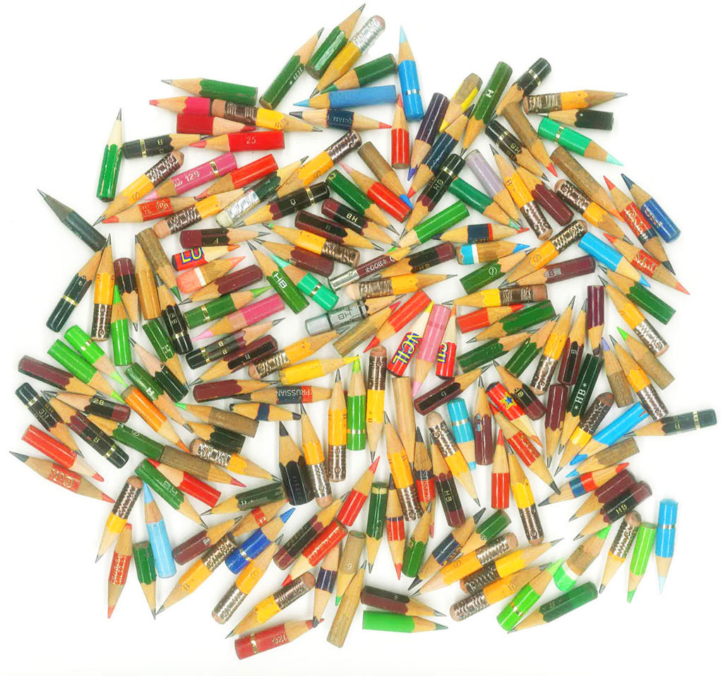 used pencils gathered at the desktop